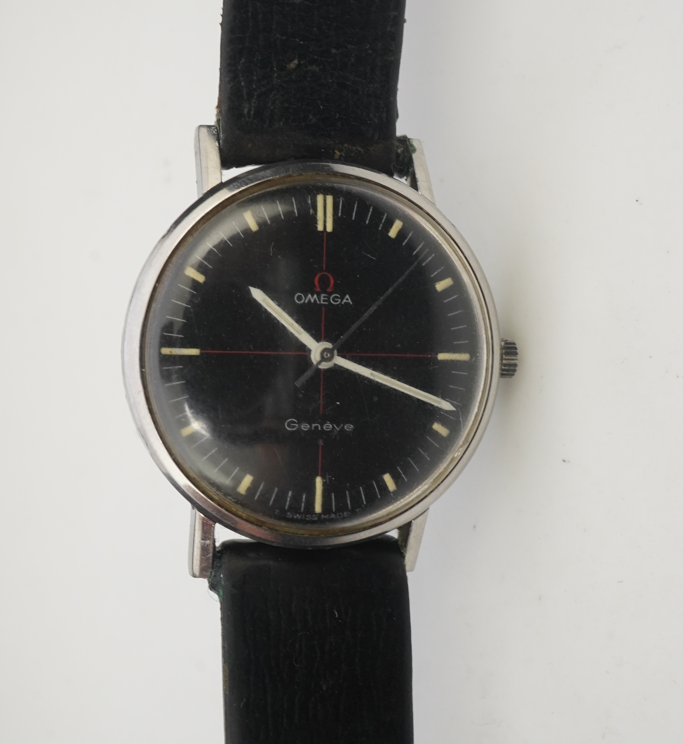 A gentleman's late 1960's/early 1970's stainless steel Omega manual wind wrist watch, the black dial with red cross-hair and baton numerals